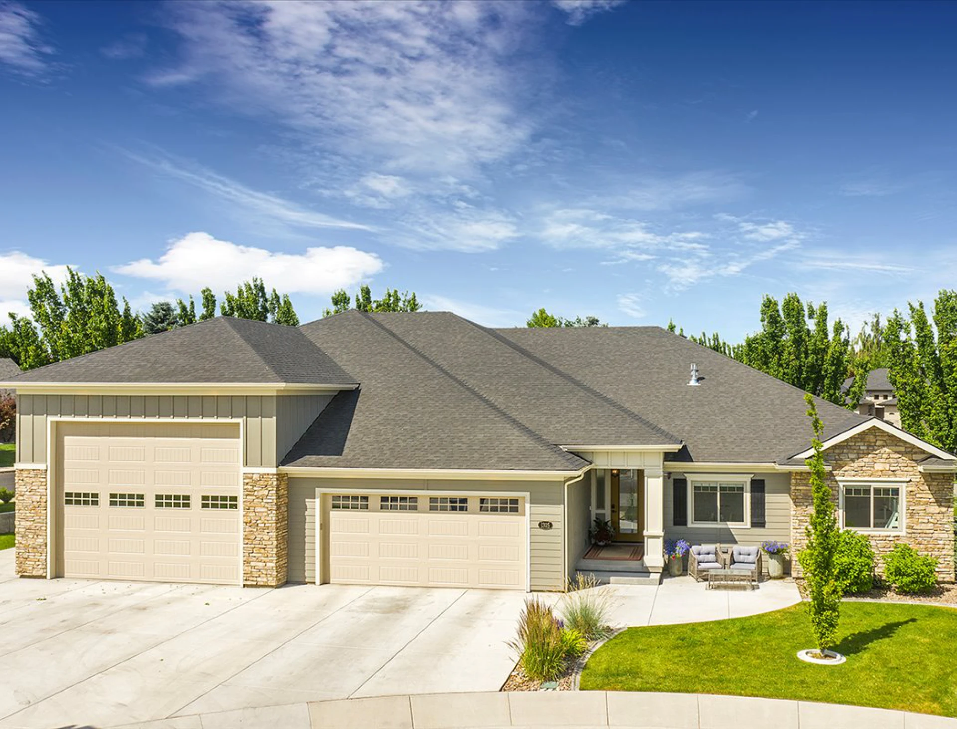 Spacious house with large driveway and lawn