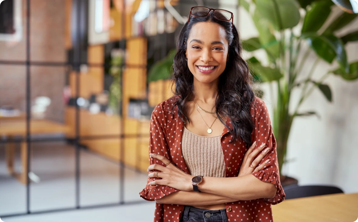 Confident woman with folded arms